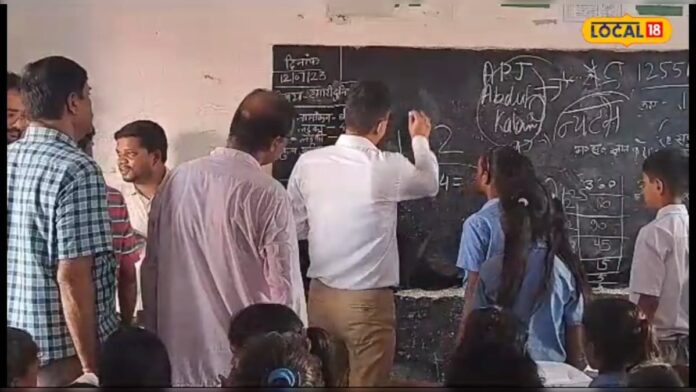 DM ने शिक्षक से 5वीं का सवाल पूछा, जवाब देने की जगह लगे गिड़गिड़ाने, वेतन कटा